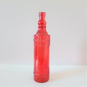 Red glass bottle.